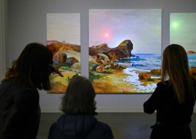 people in front of a painting